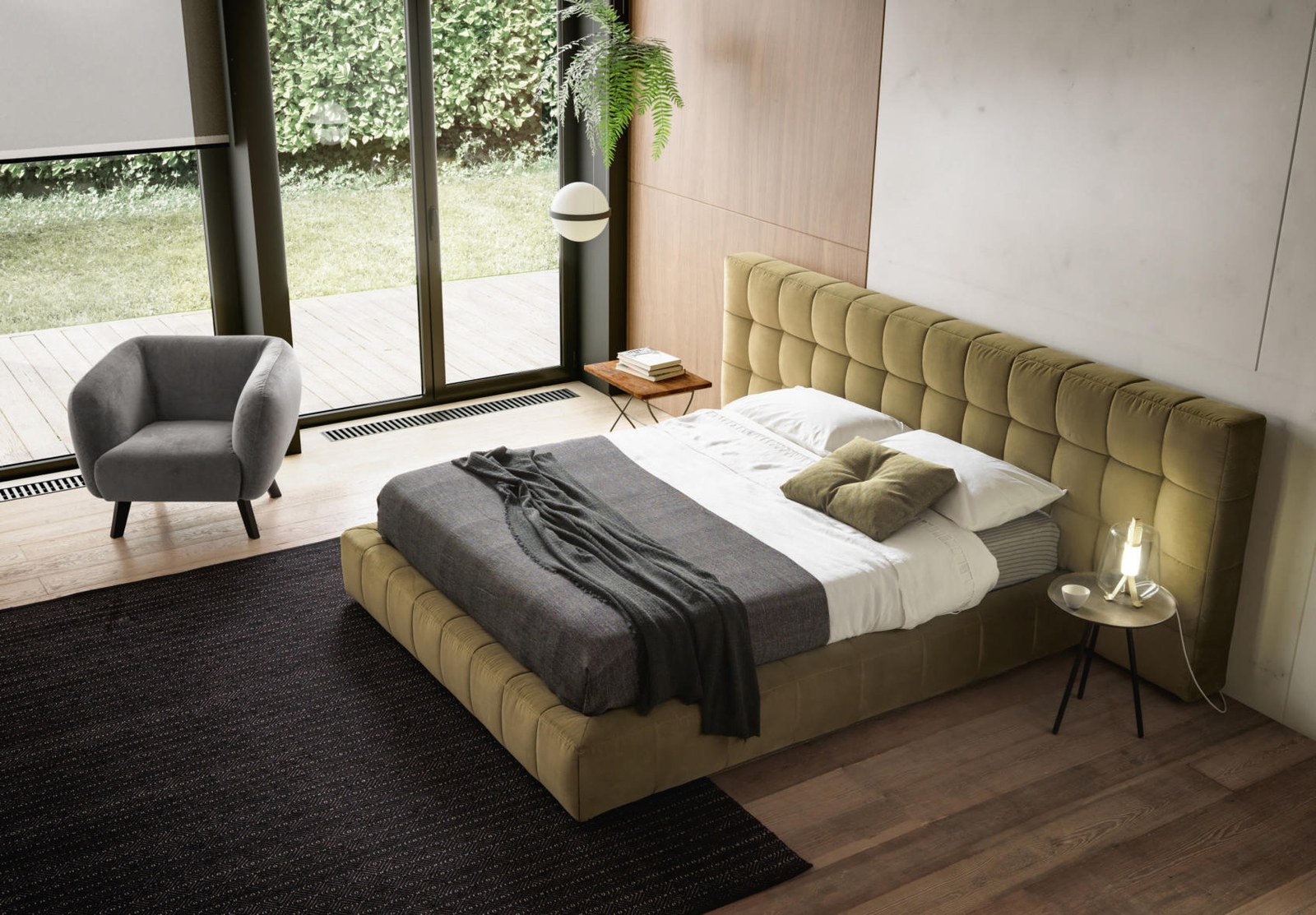 Habitación principal con cama tapizada de cabecero alto y ropa de cama en tonos tierra