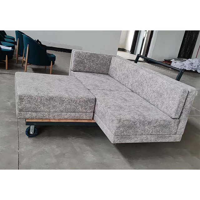 Detalle tapizado tela sofá modular hotel